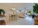 Bright living room with comfortable seating, tile floors and sliders to the patio with a view at 6059 Bahia Del Mar Blvd # 134, St Petersburg, FL 33715