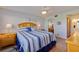Comfortable bedroom featuring a ceiling fan, matching dressers, and a golf course view at 6059 Bahia Del Mar Blvd # 134, St Petersburg, FL 33715