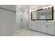 Bright bathroom featuring marble floors, a large glass shower, and double sink vanity with modern fixtures at 615 48Th N Ave, St Petersburg, FL 33703