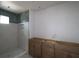 Stylish bathroom featuring tiled shower and a modern vanity, combining elegance and functionality at 615 48Th N Ave, St Petersburg, FL 33703