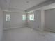 A bright bedroom featuring tray ceilings and three windows, offering a peaceful and inviting space at 615 48Th N Ave, St Petersburg, FL 33703