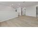 Upstairs loft area with wood-look floors and neutral paint, leading to multiple rooms at 615 48Th N Ave, St Petersburg, FL 33703