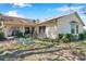 Lush backyard featuring a covered patio, metal raised garden beds and flourishing greenery at 8137 Greenside Ln, Hudson, FL 34667