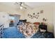Bedroom with a sliding door and exterior view to backyard at 8137 Greenside Ln, Hudson, FL 34667