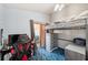 Bedroom with blue carpet, loft bed and sliding doors at 8137 Greenside Ln, Hudson, FL 34667
