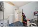 Bedroom with blue carpet, loft bed and unpainted drywall at 8137 Greenside Ln, Hudson, FL 34667