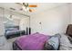 Bedroom with a window, ceiling fan, and mirrored closet doors at 8137 Greenside Ln, Hudson, FL 34667