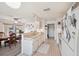 Open kitchen featuring all white appliances and dining area at 8137 Greenside Ln, Hudson, FL 34667