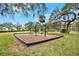 Community playground with swings featuring a wood chip ground for safe and active fun at 9527 Pebble Glen Ave, Tampa, FL 33647