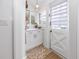 Bright entryway featuring tile floors, white cabinets, storage and natural light at 1055 Commodore St, Clearwater, FL 33755