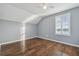 Bedroom with hardwood floors, a ceiling fan, and window with lake view at 10610 Lakeside Vista Dr, Riverview, FL 33569