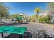 Community playground featuring a green spiral slide, picnic table, and green benches at 10610 Lakeside Vista Dr, Riverview, FL 33569