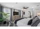 Bright primary bedroom with hardwood floors, neutral colors, a ceiling fan, and a view to the hallway at 10852 131St N St, Largo, FL 33774