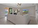 Comfortable living room with tile floors, ceiling fan, and sliding glass doors to the backyard at 1088 Belvoir Way, Spring Hill, FL 34609