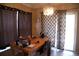 Dining room featuring brown curtains, a hanging chandelier, and a sliding glass door at 11019 Connacht Way, Tampa, FL 33610