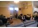 Untidy living room with a sofa, loveseat, and various personal items at 11019 Connacht Way, Tampa, FL 33610