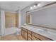 Well-lit bathroom featuring vanity, modern fixtures, and a tiled bathtub/shower combo at 11330 Lake Lucaya Dr, Riverview, FL 33579