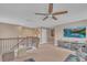 Upstairs loft area includes a staircase, seating, console and large screen tv at 11330 Lake Lucaya Dr, Riverview, FL 33579