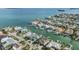 Stunning aerial view of waterfront homes with private docks and boats in a desirable coastal community at 116 9Th E St, Tierra Verde, FL 33715