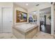 Modern bathroom with a large soaking tub and an artistic painting at 116 9Th E St, Tierra Verde, FL 33715