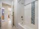 Bright bathroom with modern tub and mosaic tile accents at 116 9Th E St, Tierra Verde, FL 33715