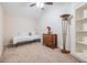 Simple yet cozy bedroom with a twin bed, dresser, and ample natural light, perfect for relaxation at 116 9Th E St, Tierra Verde, FL 33715