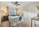 Cozy bedroom featuring a ceiling fan, window and closet at 116 9Th E St, Tierra Verde, FL 33715