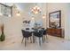 Elegant dining room featuring a contemporary chandelier and decor, plus high ceilings at 116 9Th E St, Tierra Verde, FL 33715