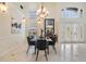 Elegant dining room with a contemporary chandelier and decor, complemented by high ceilings at 116 9Th E St, Tierra Verde, FL 33715