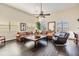 Bright living room with hardwood floors, high ceilings, fan, and comfortable seating, perfect for relaxing and entertaining at 116 9Th E St, Tierra Verde, FL 33715