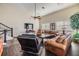 Comfortable living area with hardwood floors, couches, and a staircase, perfect for Gathering gatherings and relaxation at 116 9Th E St, Tierra Verde, FL 33715