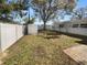 Fenced backyard with a storage shed and mature trees at 11779 82Nd Ter, Seminole, FL 33772