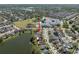 This aerial view highlights a property near a tranquil lake and is conveniently located close to a school at 1224 Cressford Pl, Brandon, FL 33511