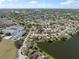 Scenic aerial view of home in a lakeside community near schools with easy access to green space at 1224 Cressford Pl, Brandon, FL 33511