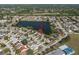 Beautiful aerial view of a single-Gathering home with a lake view in a quiet residential neighborhood at 1224 Cressford Pl, Brandon, FL 33511