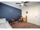 Cozy bedroom featuring carpet floors, a ceiling fan, and a desk at 1224 Cressford Pl, Brandon, FL 33511