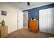 Well-lit bedroom featuring a ceiling fan, two closets, and a neutral color palette at 1224 Cressford Pl, Brandon, FL 33511