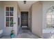 Inviting front entrance featuring a dark-wood door, decorative windows, and a charming welcome mat at 1224 Cressford Pl, Brandon, FL 33511