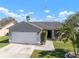 Charming single-story home with a two-car garage, landscaped yard, and inviting curb appeal at 1224 Cressford Pl, Brandon, FL 33511