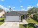 Charming single-story home with a two-car garage, landscaped yard, and inviting curb appeal at 1224 Cressford Pl, Brandon, FL 33511