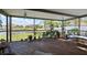 Screened in patio with a view of a serene backyard overlooking a pond at 1224 Cressford Pl, Brandon, FL 33511