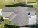 Overhead shot highlighting the property's roof showing the intricate patterns and coverage, surrounded by lush green lawns at 1224 Cressford Pl, Brandon, FL 33511