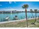 Waterfront homes featuring boat docks on a sunny day at 12340 Capri N Cir, Treasure Island, FL 33706