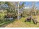 Scenic backyard with picnic table near a creek with shady trees at 12502 Lake Hills Dr, Riverview, FL 33569