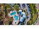 Aerial view of community amenities including a pool, clubhouse, tennis courts, and parking areas at 12820 Bent Twig Dr, Riverview, FL 33579
