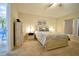 Cozy bedroom with neutral tones, carpet flooring, and stylish furnishings at 12820 Bent Twig Dr, Riverview, FL 33579
