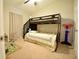 bedroom featuring a bunk bed, a ceiling fan, a basketball hoop, carpet and neutral colored walls at 12820 Bent Twig Dr, Riverview, FL 33579
