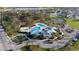 Aerial view of the community pool, clubhouse, and surrounding green spaces, showcasing amenities at 12820 Bent Twig Dr, Riverview, FL 33579