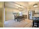 Inviting dining area adjacent to kitchen with stainless steel refrigerator, perfect for Gathering meals at 12820 Bent Twig Dr, Riverview, FL 33579