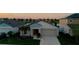 Inviting single-story home featuring a well-manicured lawn and a two-car garage, set in a tranquil neighborhood at 12820 Bent Twig Dr, Riverview, FL 33579